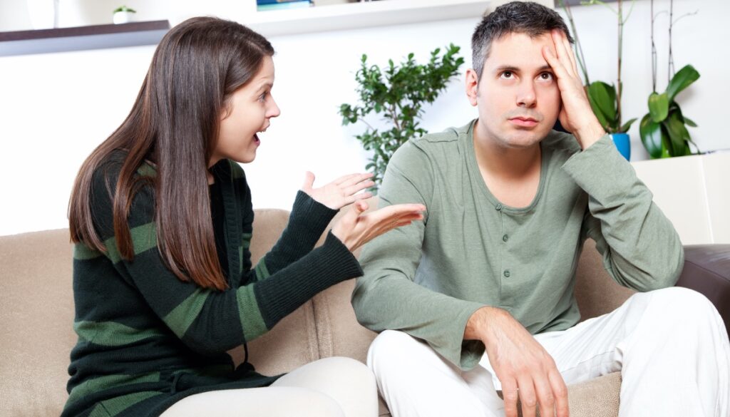 woman scolding a tired man