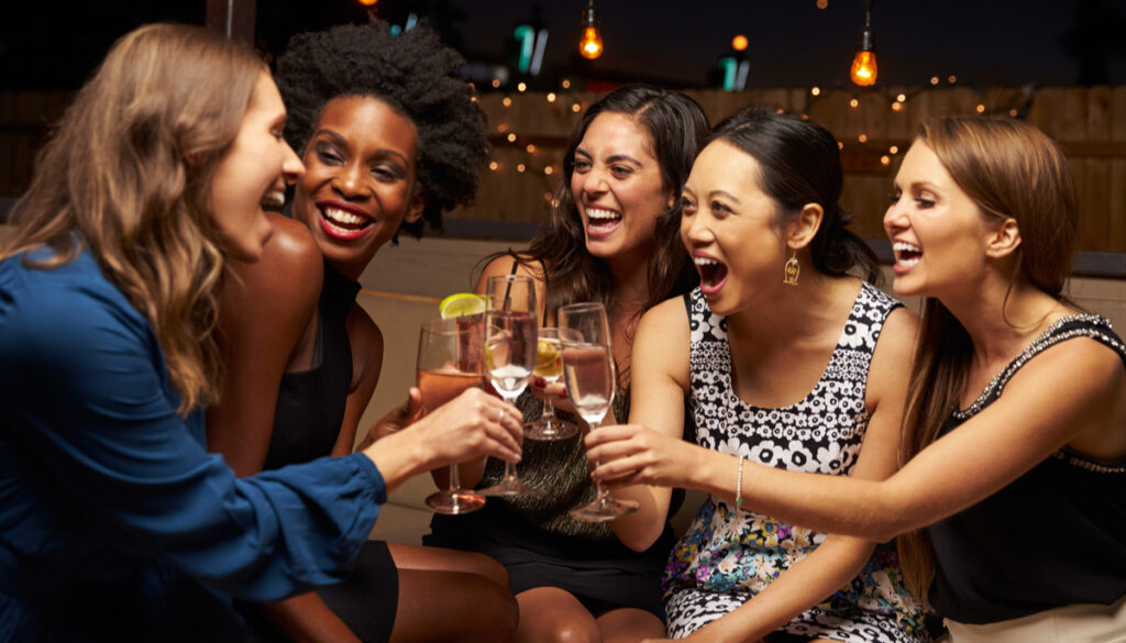 Group of friends drinking out at a bar