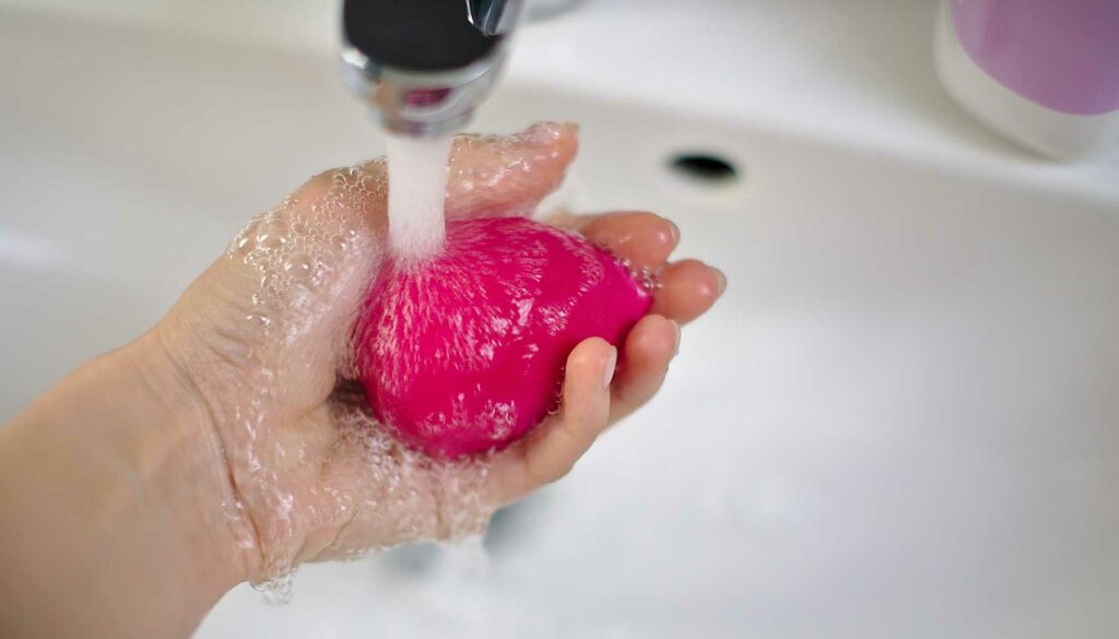 washing a makeup sponge blender