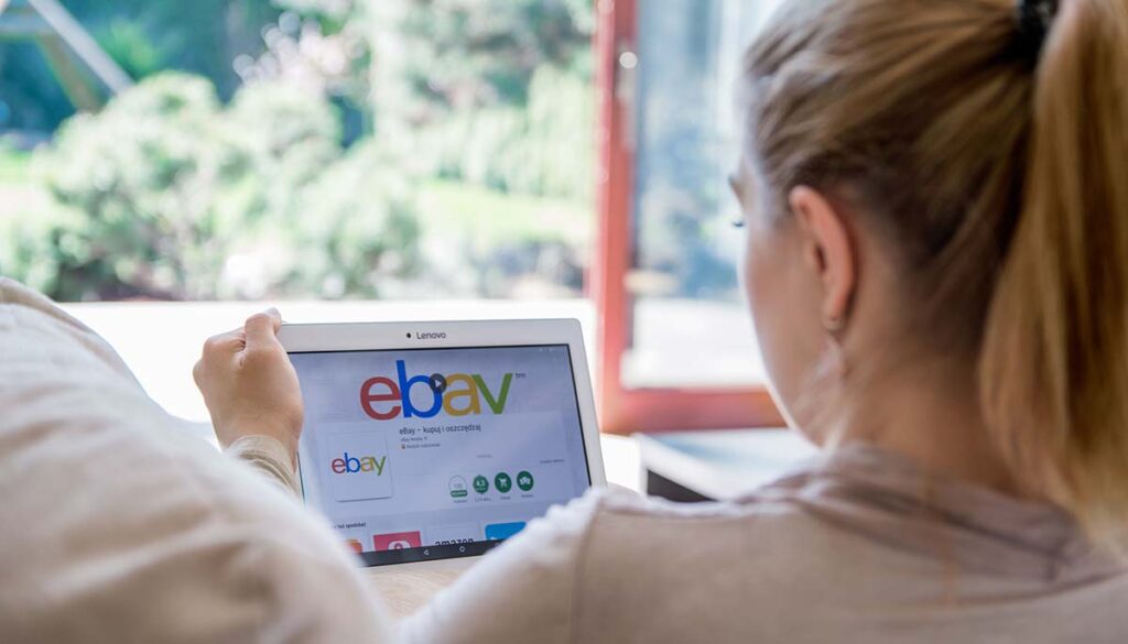 Woman is installing ebay application on Lenovo tablet. 