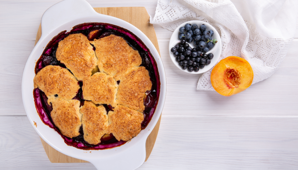 Blueberry peach crumble in white dish