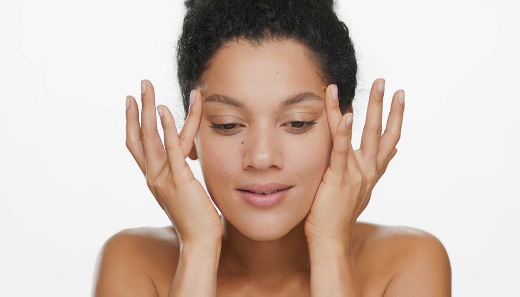 Close-up beauty portrait of woman doing eyelid exercises