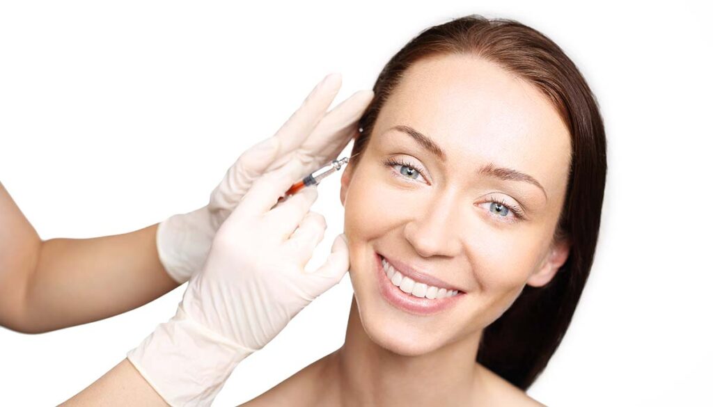 woman having her eyelid injected with botox.