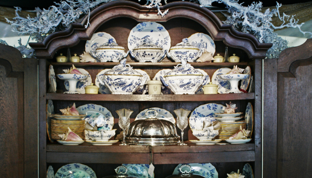 China cabinet filled with white and blue ceramics