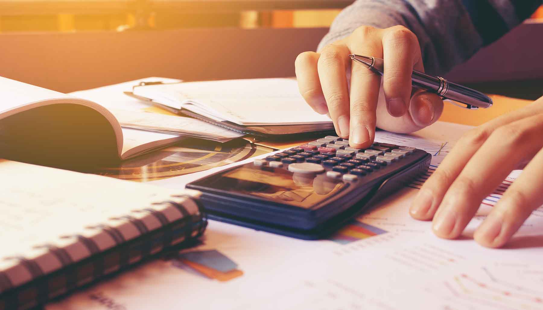 saving money, budgeting concept. using a calculator