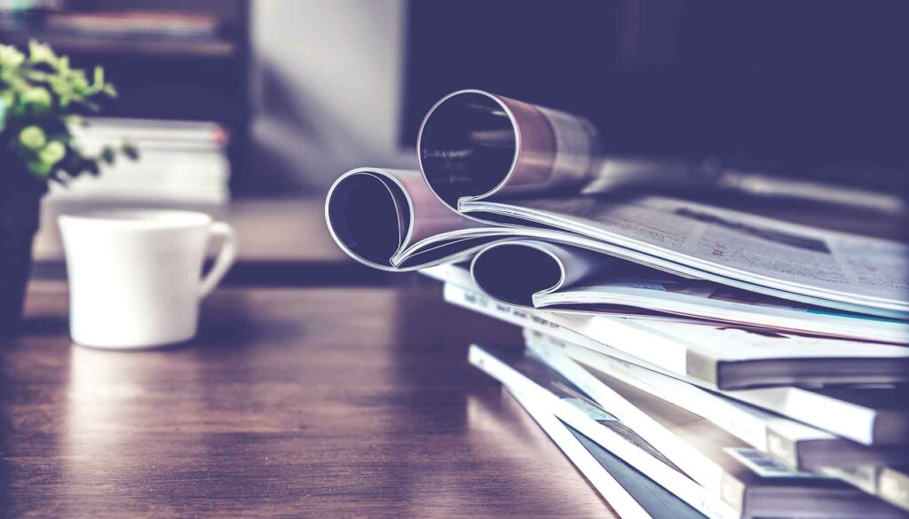 stack of magazines on coffee table