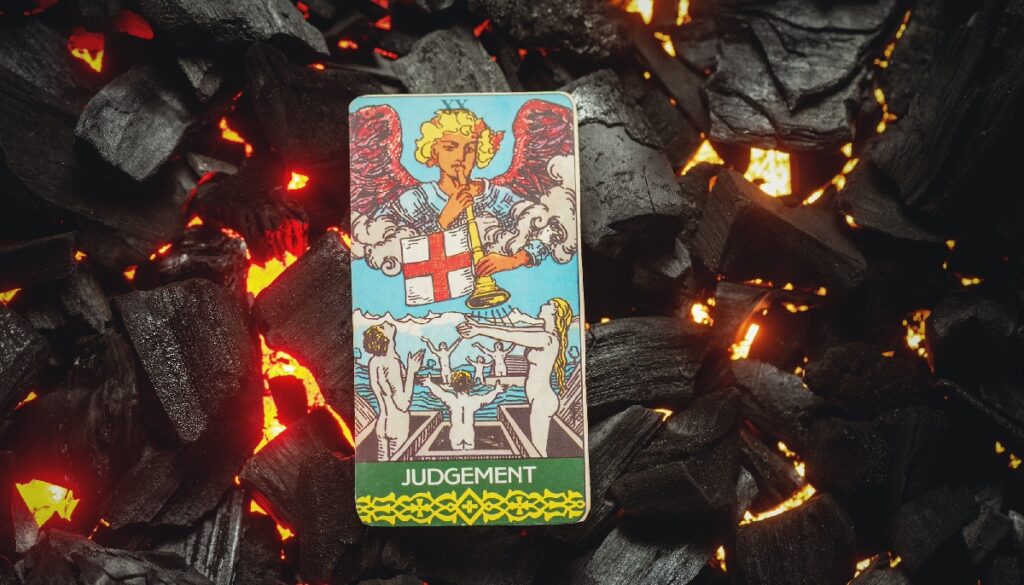 the judgement card surrounded by hot coals