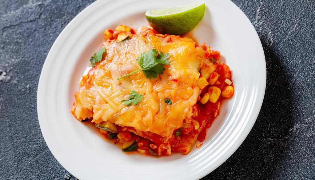 Mexican lasagna on a white plate