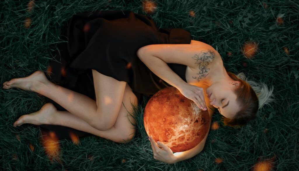 woman holding the planet Venus