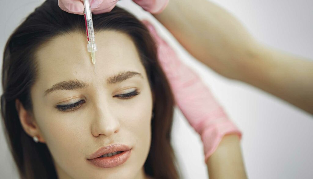 woman receiving facial injection