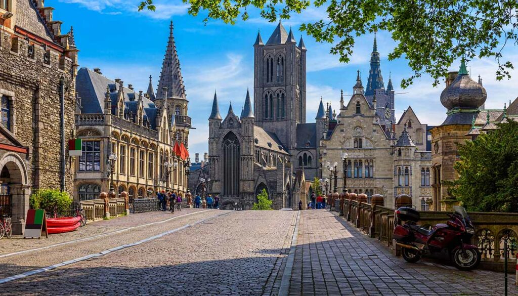 Medieval city of Gent (Ghent) in Flanders with Saint Nicholas Church and Gent Town Hall, Belgium. Cityscape of Ghent.