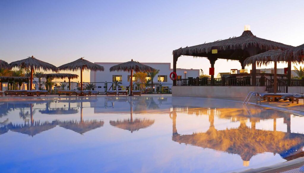 early morning, pool-side cabanas at a vacation hotel or resort