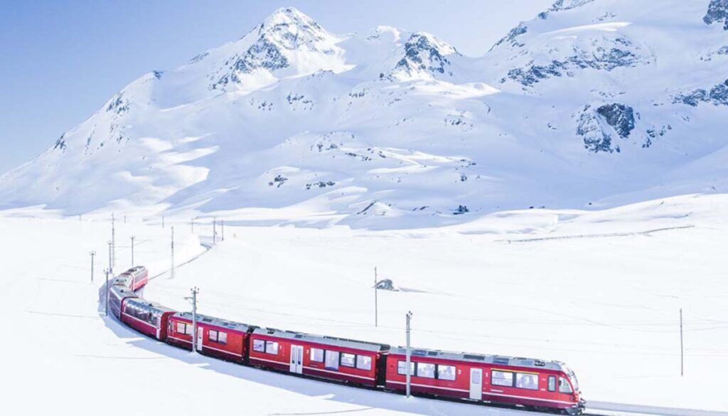 Bernina Express in Winter surrounded by snowy mountains