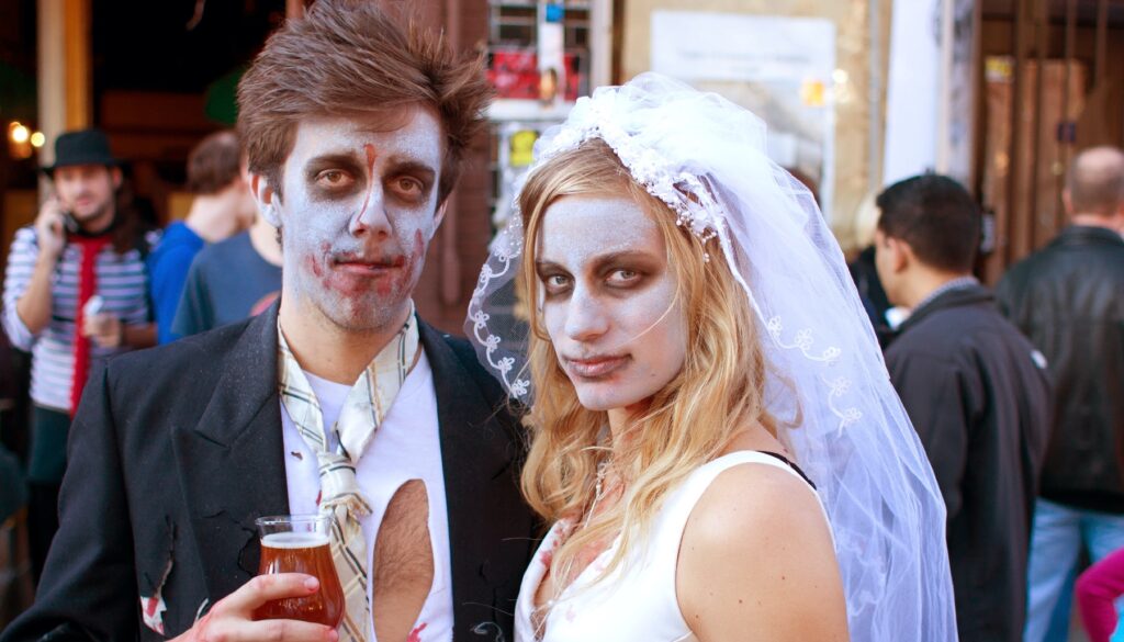 a couple dressed like zombies
